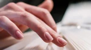 Closeup woman shows her natural nails